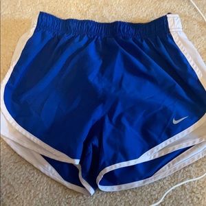 Blue and white nike running shorts
